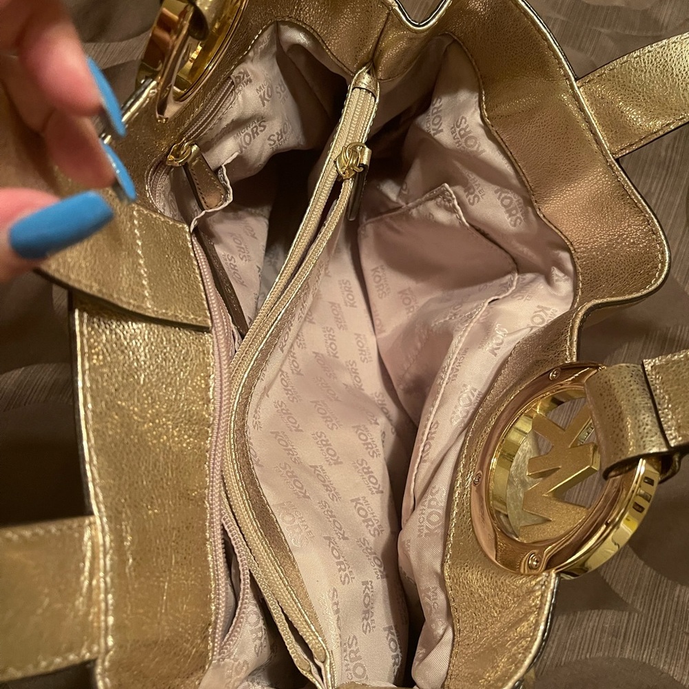 MK gold in color purse excellent condition